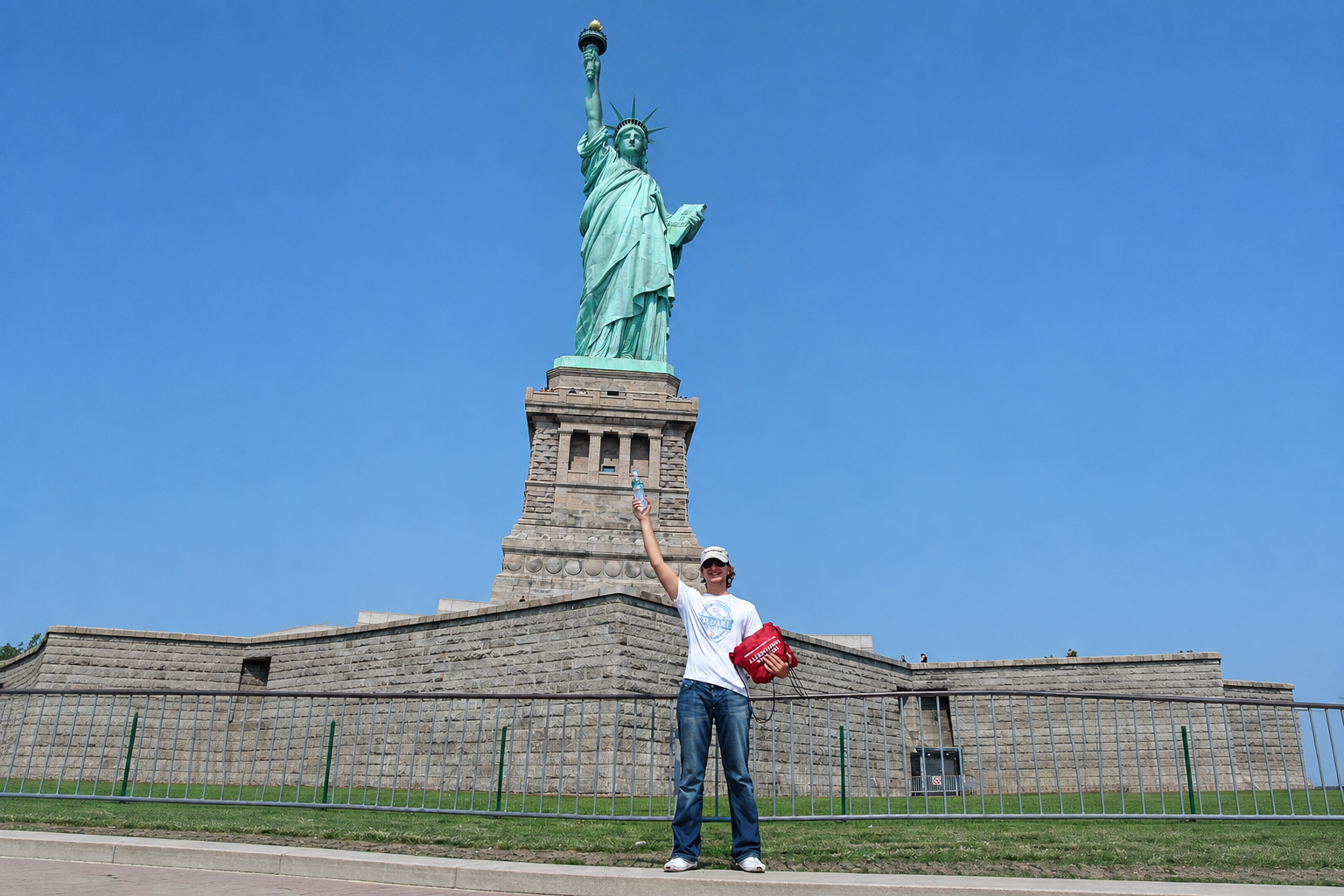 Travel portrait with the Statue of Liberty and an expanded landscape background